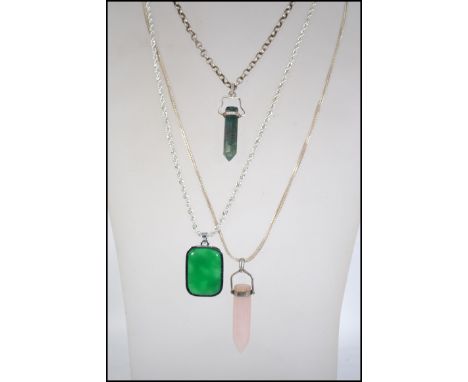 A group of three silver 925 necklace chains one being a rolo link chain with a moss agate stone crystal drop pendant, one bei