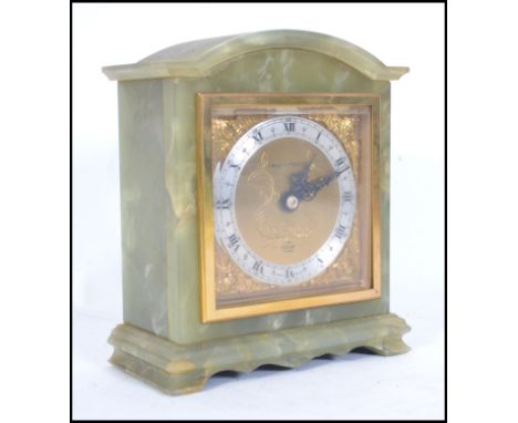 A mid century green marble mantel clock by Mappin &amp; Webb dual marked also for Elliott of London. Brass spandrels with sil