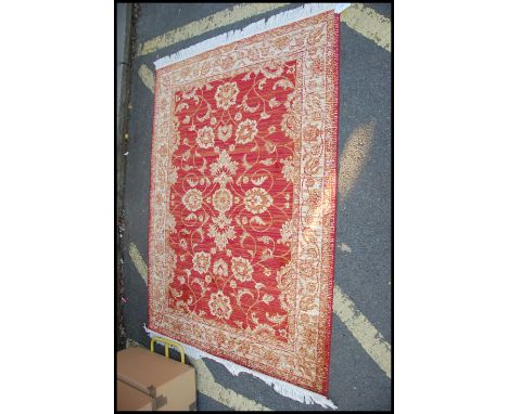 A large Persian Ziegler carpet - rug having red ground with geometric decoration and borders. Often also known as a Chobi Rug