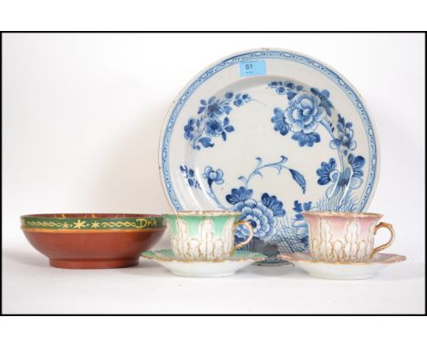 A late 18th century early 19th English Delft plate, blue and white floral patterned together with a wooden Scandinavian egg d