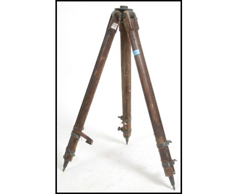 A large vintage Industrial early 20th century wooden tripod - ideal for studio / cinema theatre light. The tripod with large 