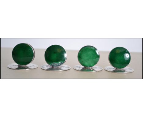 A set of four silver and enamel hallmarked place setting name holders, Birmingham assay mark, letter K&nbsp;