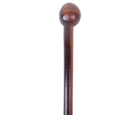 Early Tribal Knobkerrie, being of two tone hardwood with small oval type head and long shaft. 81cms in length. 