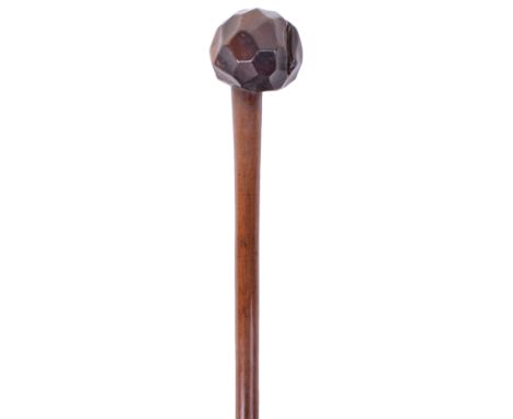 Scarce Zulu Knobkerrie with Concave Facetted Head, tapering polished shaft. Large split to the head. 66cms in length. 