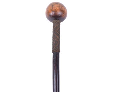 Zulu Knobkerrie, of hardwood with bulbous two tone head. Shaft with five sections of two tone copper wire binding. 69 ½ cms i