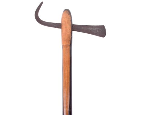 Zulu Battle Axe, good 19th century example with steel flattened blade and hook. Two tone wooden haft. Blade 22cms, haft 59cms