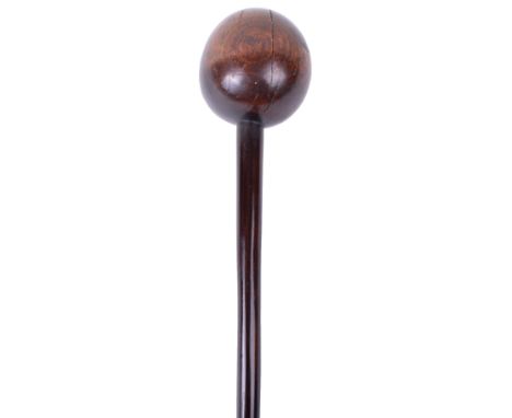 Zulu Knobkerrie, polished hardwood example in a dark two tone. Bulbous head with thin shaft. Some light stress lines and area