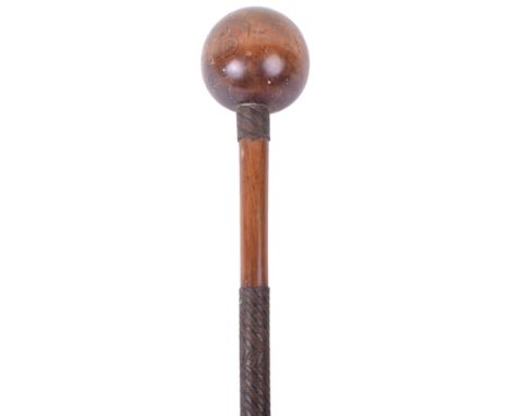 Zulu Knobkerrie, being a light coloured hardwood example with bulbous head. Shaft having three sections of two tone wire bind