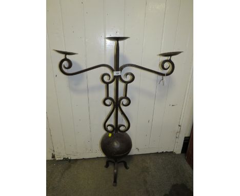 A LARGE WROUGHT IRON DECORATIVE THREE BRANCH CANDELABRA