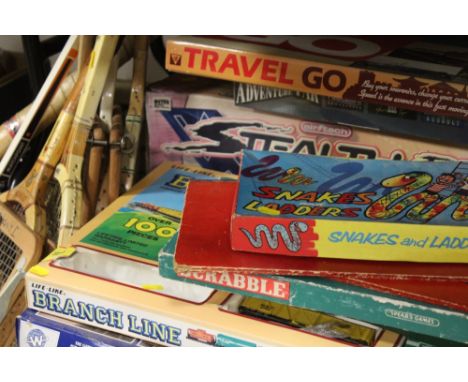 A COLLECTION OF VINTAGE BOARD GAMES, TRAIN SETS ETC., TOGETHER WITH A SELECTION OF VINTAGE WOODEN SPORTS RACQUETS AND A HOCKE