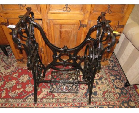 A VINTAGE CAST SEWING MACHINE TREADLE BASE