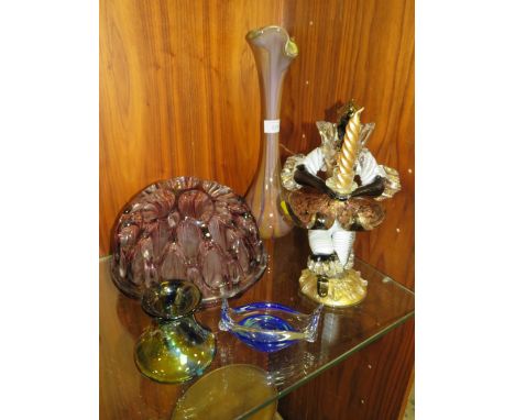 A SELECTION OF STUDIO GLASSWARE TO INC A MURANO FIGURAL CANDLESTICK AND A LARGE AUBERGINE GLASS FLOWER FROG (5)