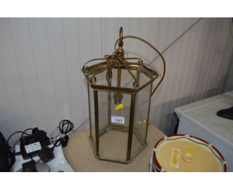 A brass and glass hanging light fitting 