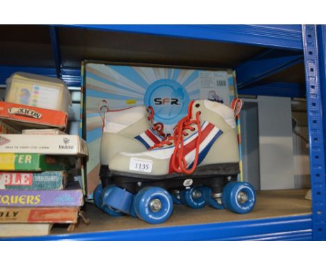 A pair of boxed roller skates 