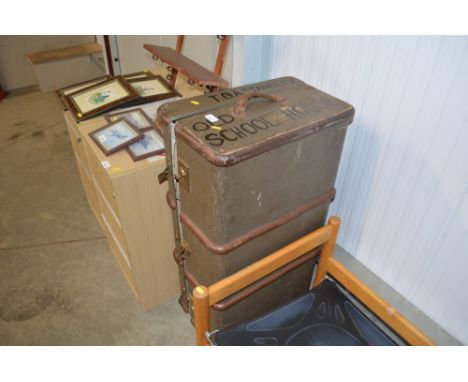 A wooden bound travelling trunk