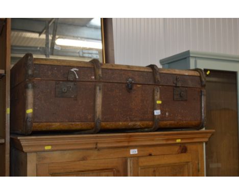 A wooden bound travelling trunk 