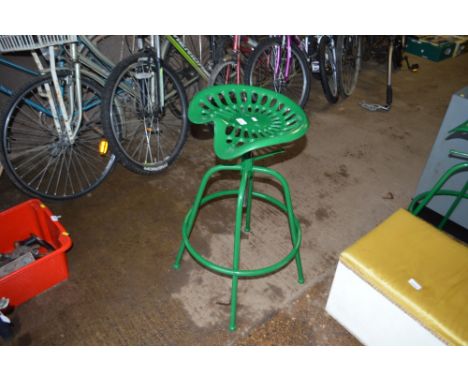 A tractor seat stool (55)