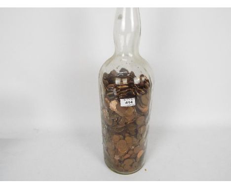 Penny Jar - a vintage glass Bells whisky bottle, 52 cm (high) containing a very large collection of UK 1p and 2p coins (new p