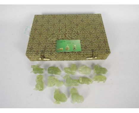 A set of Chinese zodiac jade carvings contained in presentation box.