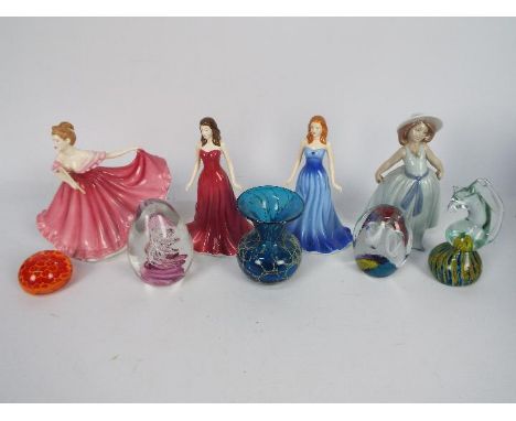 Ceramic figurines to include Lladro and Royal Doulton and a collection of glass paperweights and a vase.