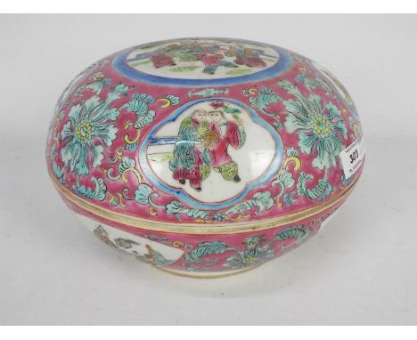 A Chinese ceramic bowl and cover, the body of the bowl decorated with panels of figures set between lotus scrolls above a lap