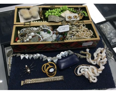 LOT OF COSTUME JEWELLERY, including brooches and necklaces, contained in an tartanware casket