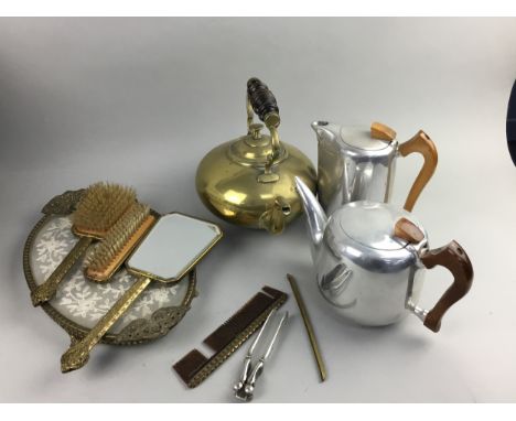 PICQUOT WARE TEA AND COFFEE POT, along with an early 20th century brass vanity set, a nut cracker and a brass kettle