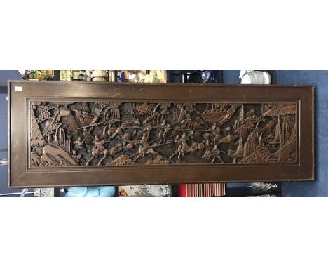 20TH CENTURY CHINESE CARVED WOOD WALL PANEL, carved in relief with warriors on horseback, 61cm x 182cm