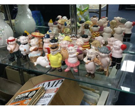 LOT OF VARIOUS CERAMIC 'PIGGIES' FIGURES, including 'Snout of Africa', 'Pig Pen' and 'Hamfisted'