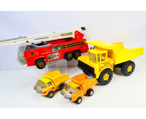 Tonka - A group of unboxed trucks including Fire Truck and Turbo-Diesel Dump Truck, they show signs of play use and appear Fa