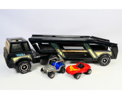Tonka - An unboxed Tonka Car Transporter with a Jeep and a Beach Buggy. They show signs of play use and appear Fair to Good o