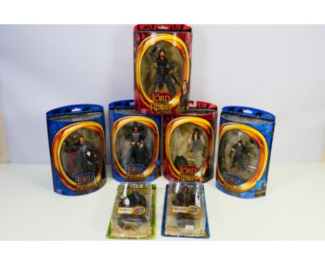 Lord Of The Rings - A group of figures including Frodo, Lurtz, Aragorn King Of Gondor, and others. The figures appear Mint in