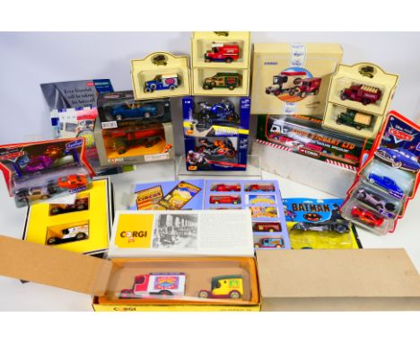 Corgi - Maisto - Pixar - Ertl - A group of boxed / carded models including Honda RCV 211 in 1/18 scale, Bryant & May Delivery