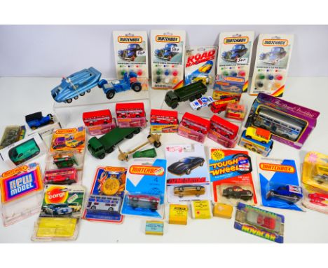 Corgi - Matchbox - Dinky - Schuco - A collection of mostly boxed and carded models including 4 x boxed Londoner buses in Lake