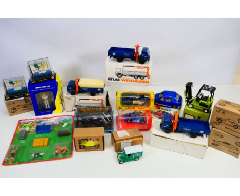 Conrad - Scalextric - Britains - A group of boxed / carded models including 3 x Conrad Mercedes trucks, a Fork Lift, a Scalex