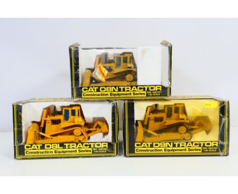 NZG - 3 x boxed construction vehicles in 1/50 scale, Cat D8L Tractor # 233, Cat D9N # 298 ad Cat D8N # 233. The D8L has some 