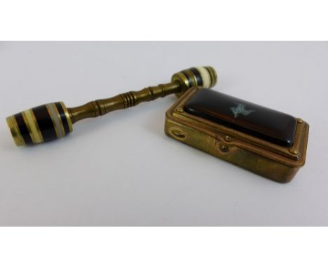 Brass match holder with shell inlaid Manx symbol and a bone and brass knife rest with combined toothpick