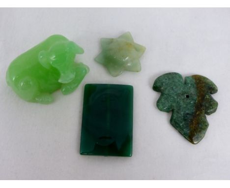 Four pieces of Oriental carved jade including a cow