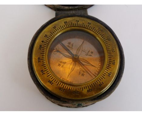 Leather cased brass compass