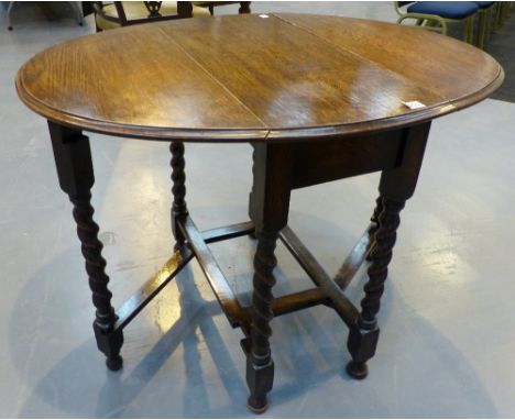 Oak drop leaf gate leg oval dining table 100 x 80 cm.