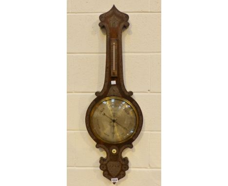 Antique stick barometer thermometer in carved wooden banjo shaped mount. signed J.Esplin Wigan H: 105 cm