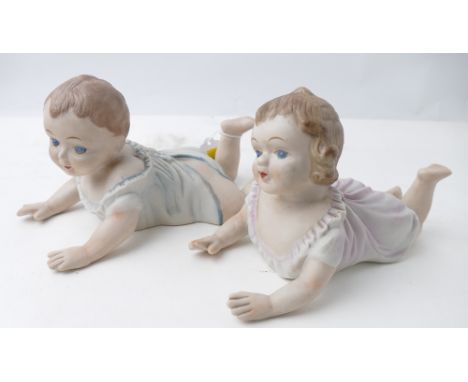 Two unmarked ceramic piano babies