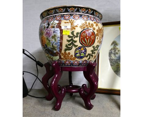 Oriental style ceramic jardiniere on wooden stand, 43 cm high