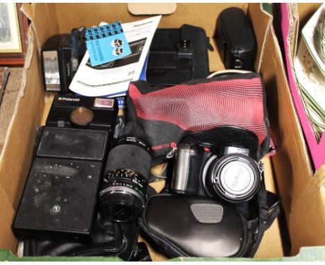 Box of vintage camera equipment, Polaroid, Fine Pix S602 zoom, pocket camera and other camera accessories   