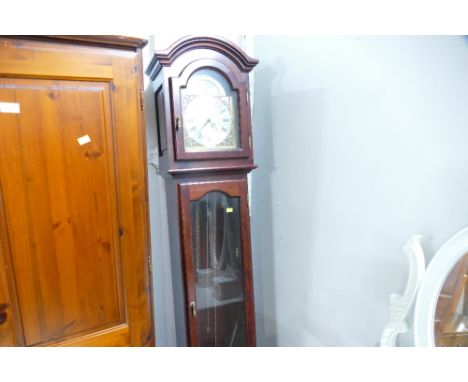 Modern longcase clock with brass face 