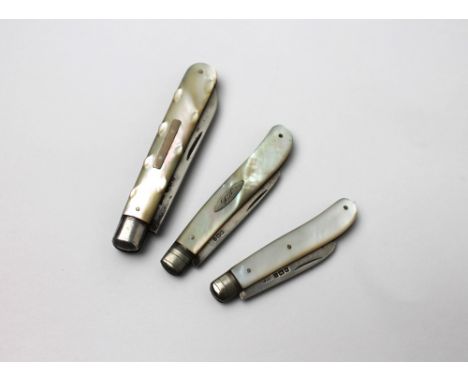 Three miniature mother of pearl handled penknives with silver blades This bladed product is not for sale to people under the 