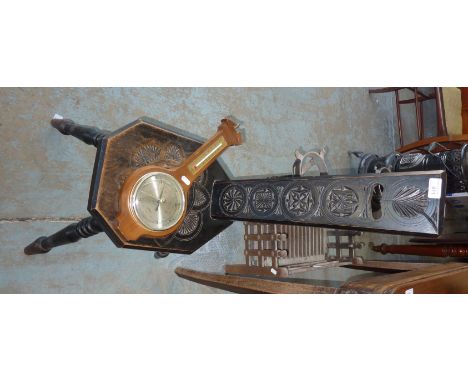Carved oak and ebonised spinning chair and a small modern wall mounted barometer 