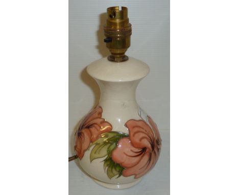 Small Moorcroft table lamp with lily pattern on cream ground