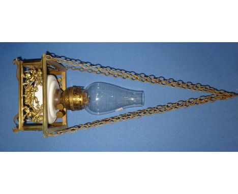 Unusual centre hanging oil lamp with square brass handle cradle with panels of various cupids, fitted with ceramic reservoir 