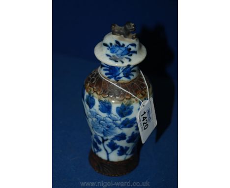 A Chinese  Blue and White Crackle Glazed Porcelain Covered Vase with Brown Banded Decoration and Shishi Dog Finial.